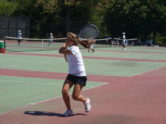 Volunteer pro Daniel Burgess (third from left) and PTA moms from Merrick promote the QuickStart Tennis program
