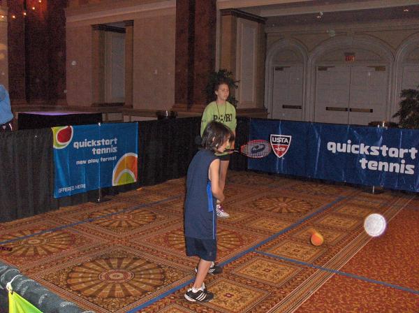 Kids in Freeport learning tennis from USTA volunteers