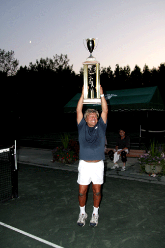 Jerry Wasserman, captain of the North Shore Men’s Tennis League 2009 champion Woodbury Tennis, celebrates his team’s victory