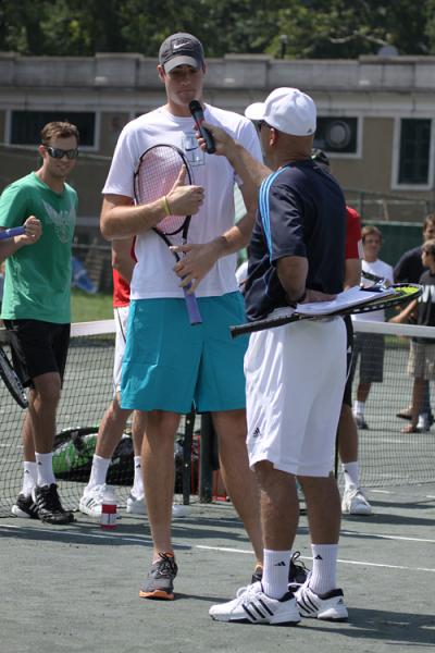 John Isner (left) shares some tips with attendees of the Prince EXO3bition in Central Park 
